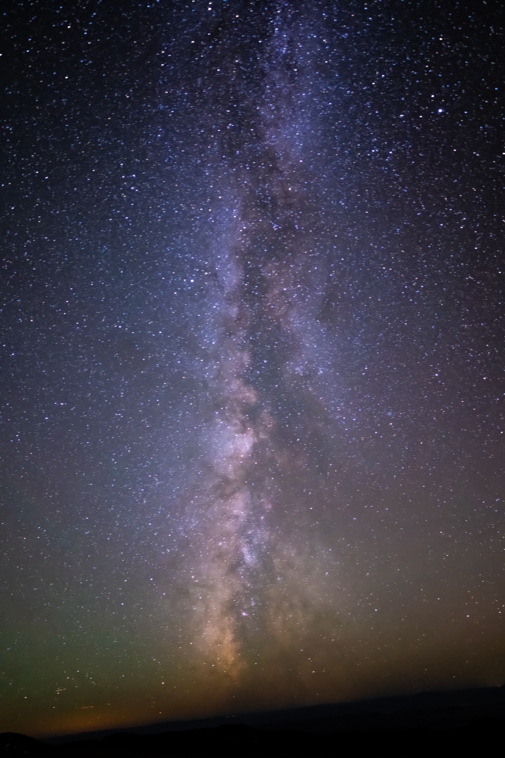 Vertical Milky Way above a distant dark horizon